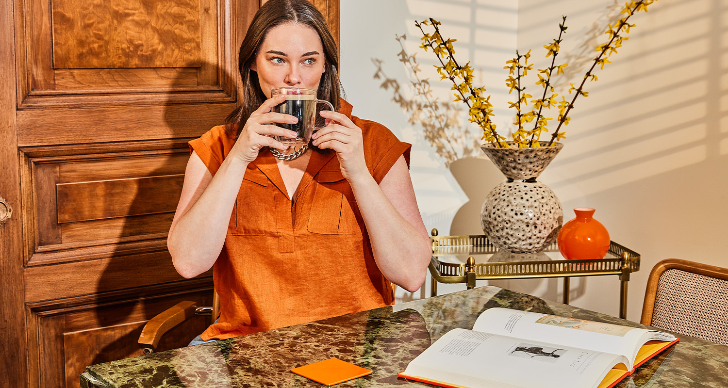 woman sipping on coffee