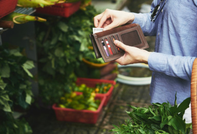 Woman looking through wallet