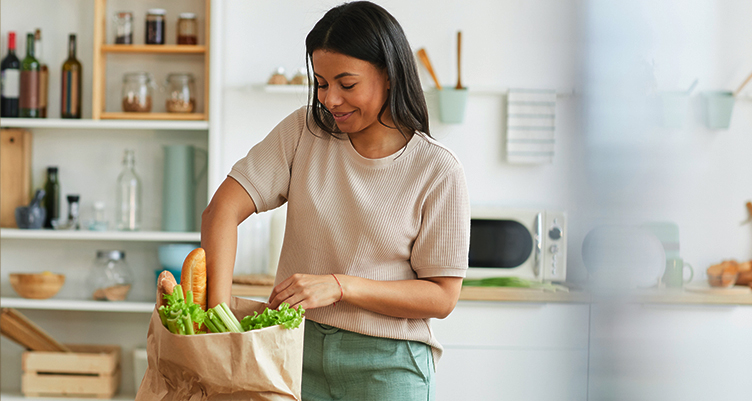 woman unpacks groceries