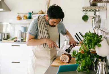 A man cooking dinner in the kitchen