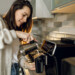 women pouring fresh coffee into her cup