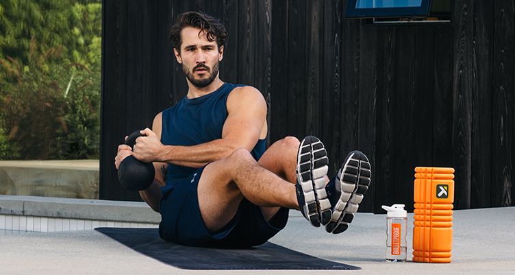 Man with beard doing core exercises