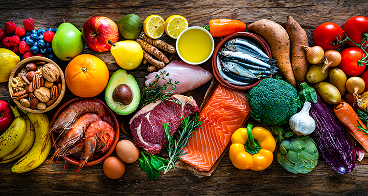 a platter of healthy vegetables, meat, eggs, and fats