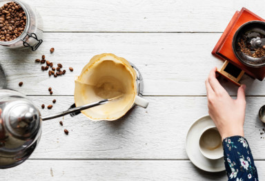 Person brewing coffee with pourover method