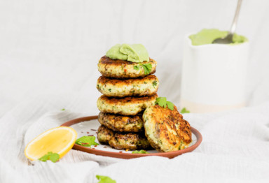 Stack of keto fish cakes with avocado lemon sauce