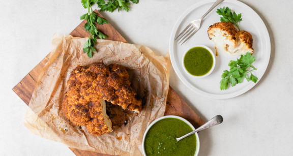 Whole roasted cauliflower with chimichurri sauce