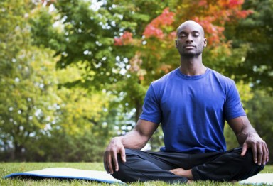 Man meditating outside