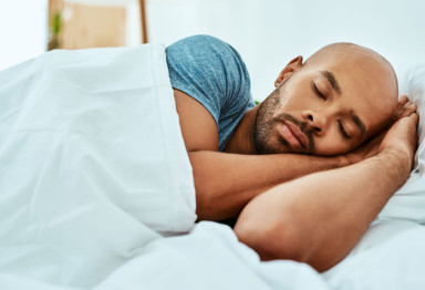 Man sleeping in bed