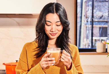 women enjoying a cup of coffee in a clear cup